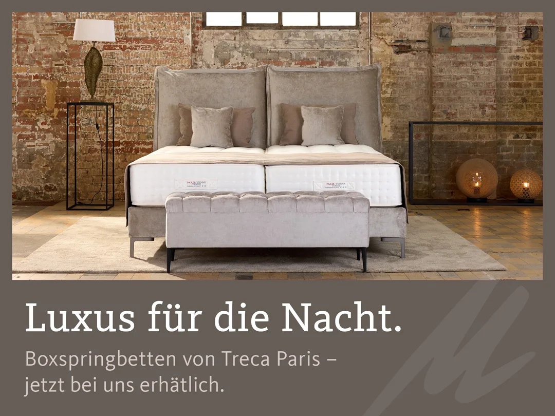 Ein Bild eines Boxspringbetts von Treca Paris, darunter der Slogan "Luxus für die Nacht."